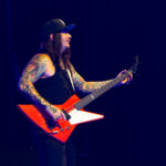 Jason Aldean performing guitar at Spark Arena during a 2026 concert.