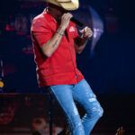 Jason Aldean singing on stage at Spark Arena, New Zealand, during his 2026 concert.