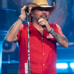 Jason Aldean performing on stage at Spark Arena, New Zealand, during his 2026 concert.