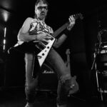 Guitarist playing energetic solo on stage at The 13th Floor during Push Push event in Auckland.