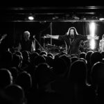 Push Push band performing live on stage at The 13th Floor concert venue.