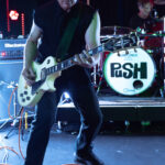 Guitarist performing live at The 13th Floor during Push Push's Double Whammy event, showcasing energ.