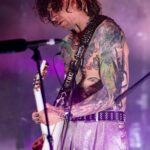 Guitarist from The Darkness performing passionately at Powerstation, February 17, 2026.