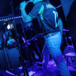 Harper Finn performing on stage at The 13th Floor during a concert.